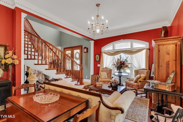 interior space with ornamental molding, hardwood / wood-style floors, and a notable chandelier