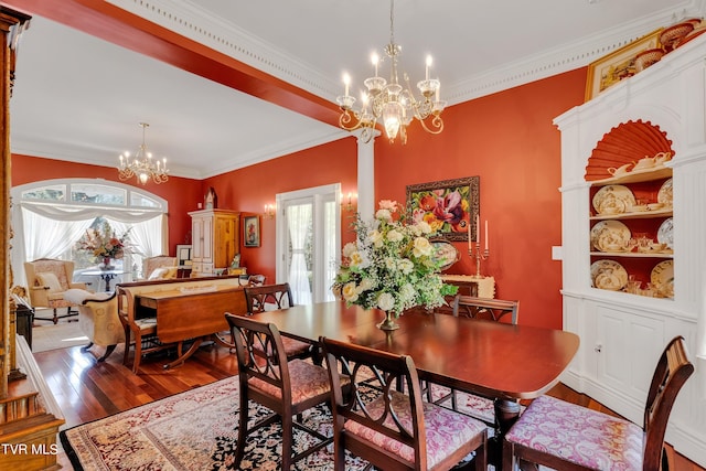 dining room featuring a wealth of natural light, crown molding, an inviting chandelier, and dark hardwood / wood-style flooring