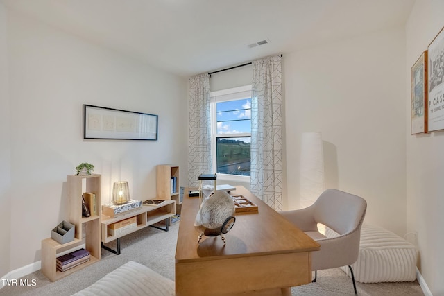 carpeted office featuring baseboards and visible vents