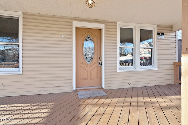 property entrance featuring a wooden deck