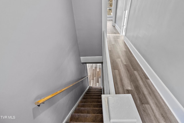 stairway featuring hardwood / wood-style floors