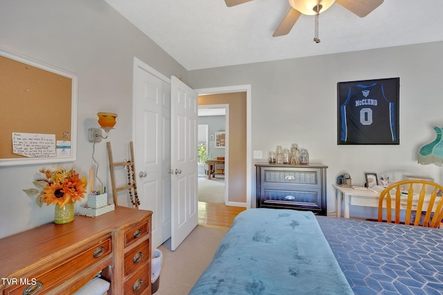 carpeted bedroom featuring ceiling fan