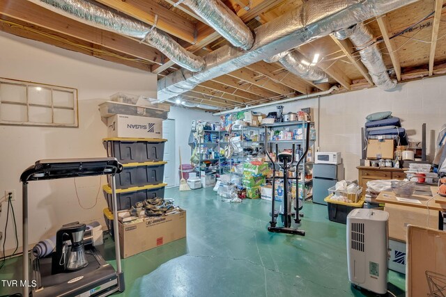 basement featuring white refrigerator