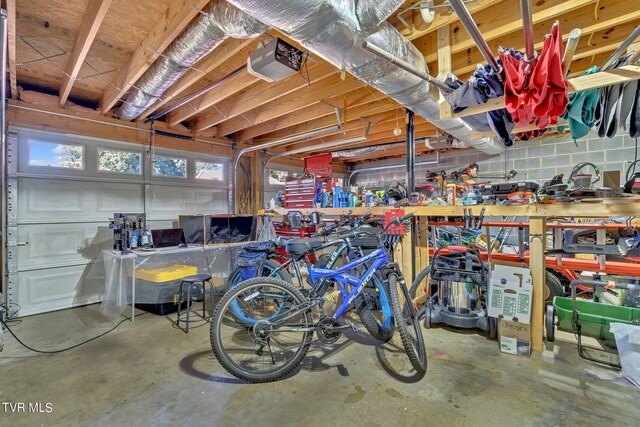 garage featuring a workshop area and a garage door opener