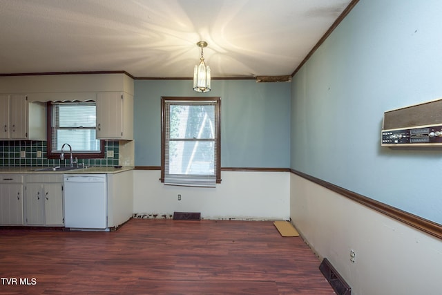 kitchen with dishwasher, ornamental molding, plenty of natural light, and a sink