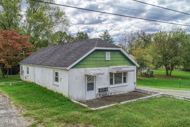 view of outbuilding featuring a yard