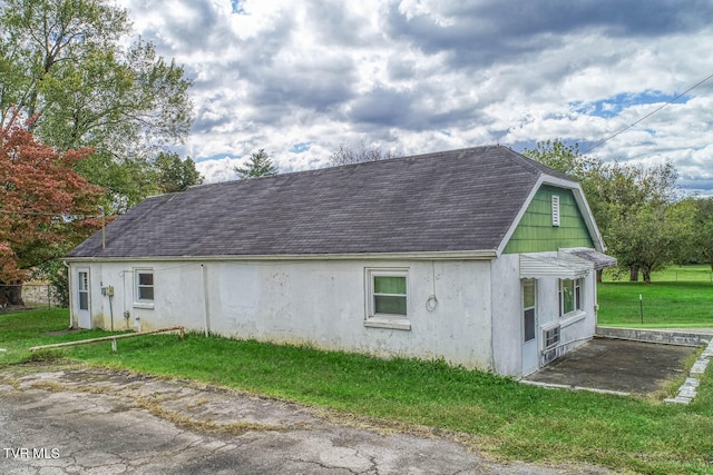 view of property exterior featuring a yard