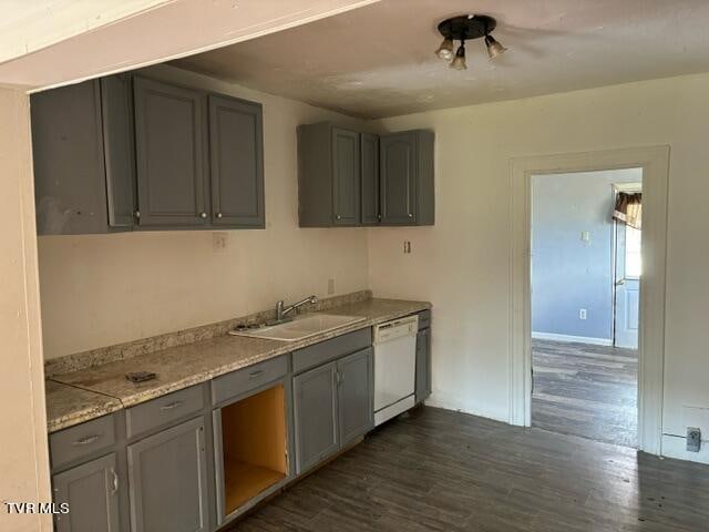 kitchen featuring gray cabinets, dishwasher, dark hardwood / wood-style flooring, and sink