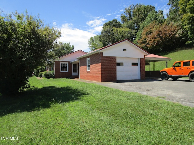 view of side of home featuring a yard and a garage