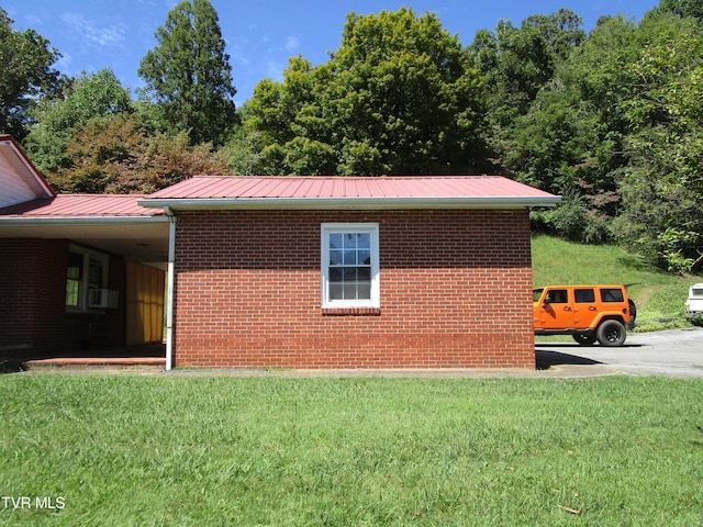 view of property exterior with cooling unit, a lawn, and a carport