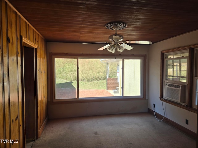 unfurnished sunroom with cooling unit, wooden ceiling, and ceiling fan