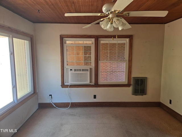 spare room featuring cooling unit, light colored carpet, wooden ceiling, and ceiling fan