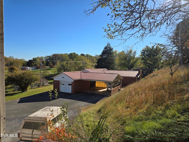 view of front of house featuring a carport and a garage