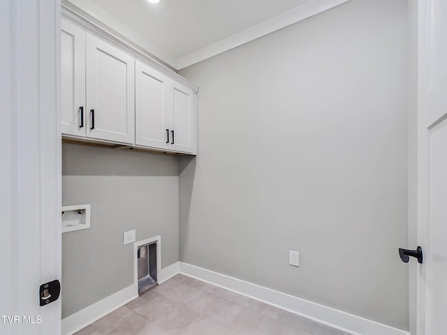 washroom with washer hookup, hookup for an electric dryer, cabinets, and crown molding