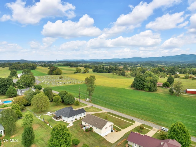 birds eye view of property featuring a mountain view and a rural view