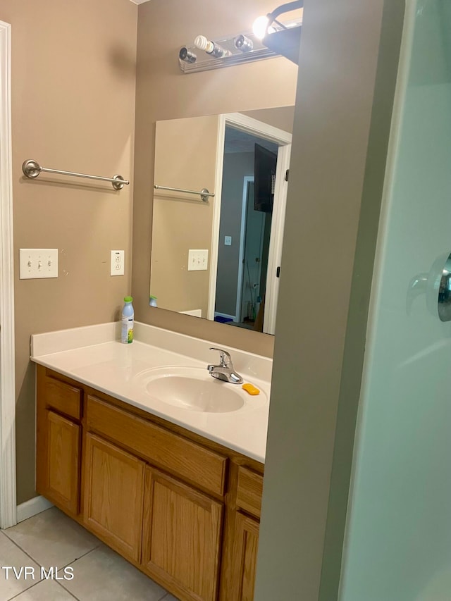 bathroom featuring tile patterned floors and vanity