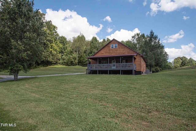 cabin with a front yard