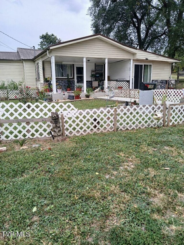 view of front of house featuring a front yard and a porch