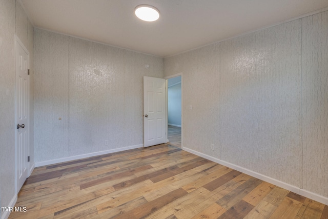 unfurnished room with light hardwood / wood-style floors