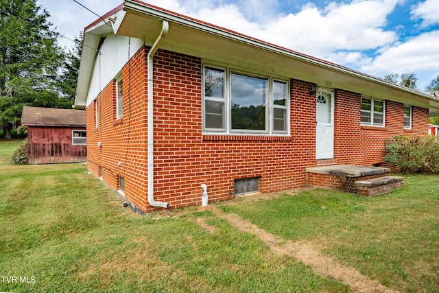 back of house with a lawn