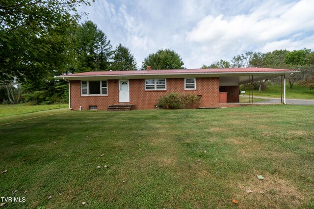 single story home featuring a front lawn and a carport