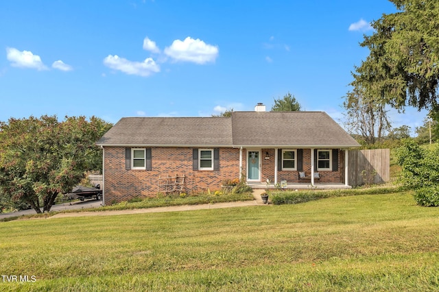 ranch-style home featuring a front yard