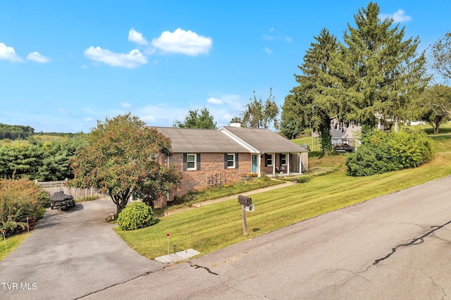 ranch-style house with a front yard