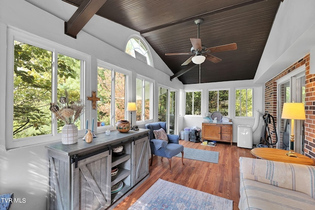 sunroom with vaulted ceiling and ceiling fan