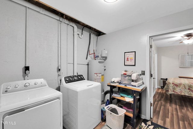 clothes washing area with water heater, ceiling fan, wood-type flooring, and washing machine and dryer