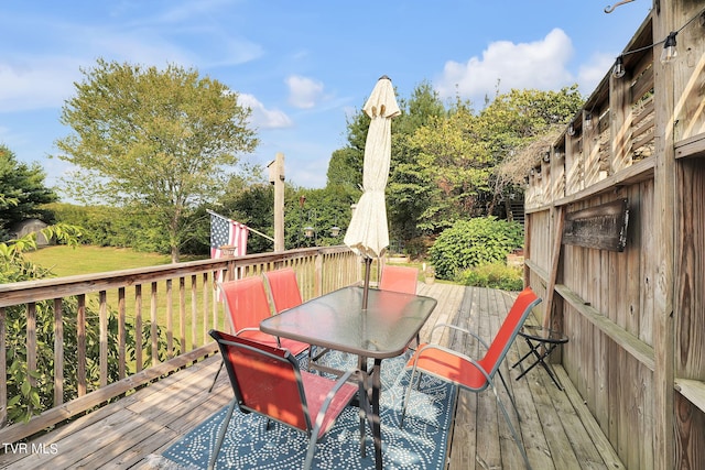 wooden deck with a yard