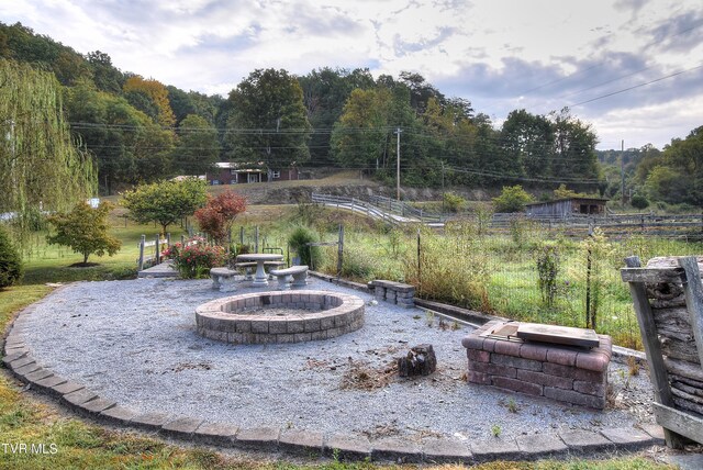 view of patio / terrace featuring a fire pit