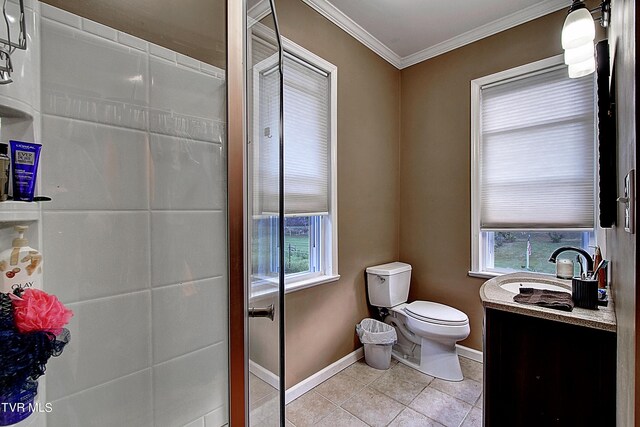 bathroom with vanity, crown molding, toilet, and a wealth of natural light