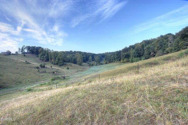 mountain view featuring a rural view