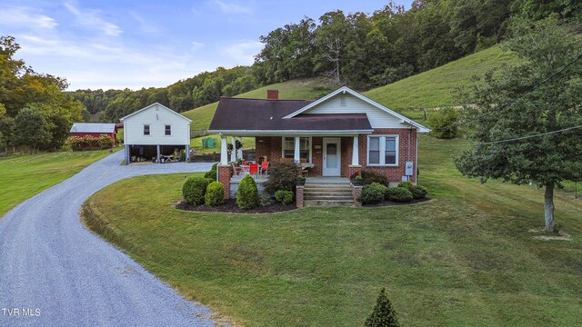 view of front of house featuring a front lawn and a porch