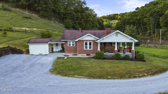 ranch-style house with a front lawn