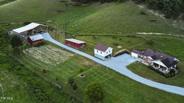 birds eye view of property featuring a rural view