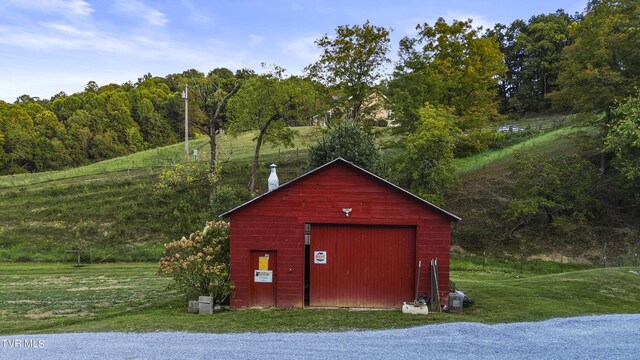 view of outbuilding featuring a yard and a garage