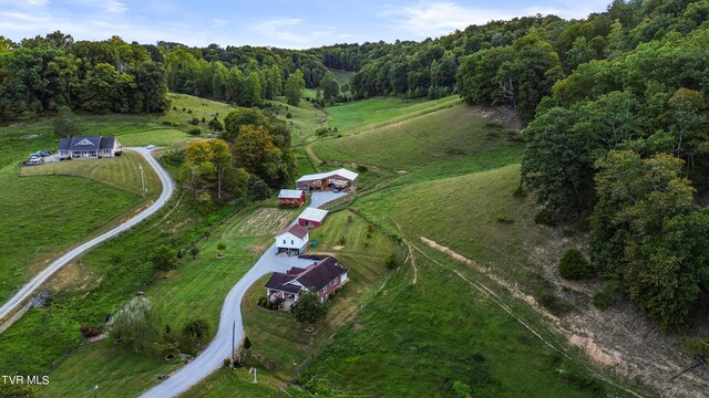 birds eye view of property featuring a rural view