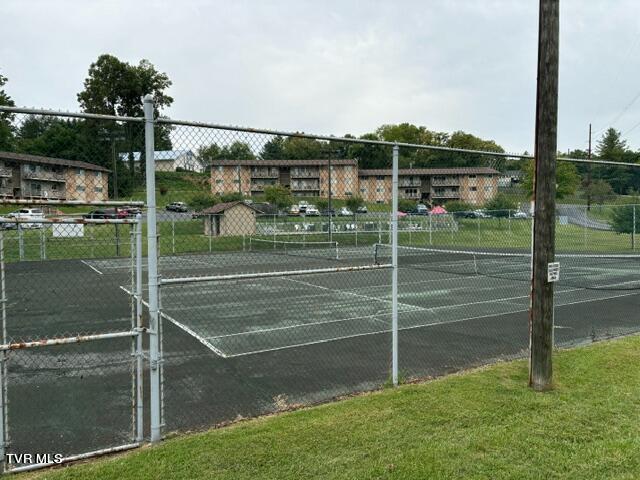 view of sport court with fence