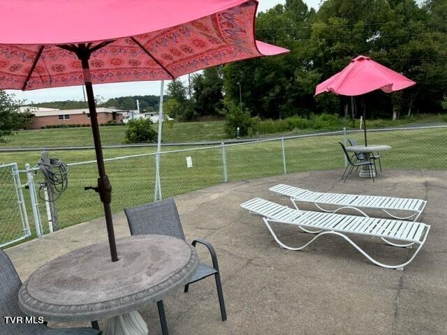 view of patio / terrace featuring fence