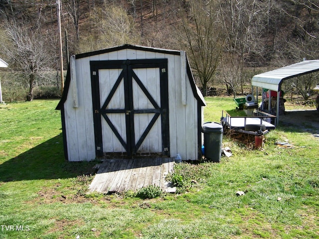 view of outbuilding with a lawn