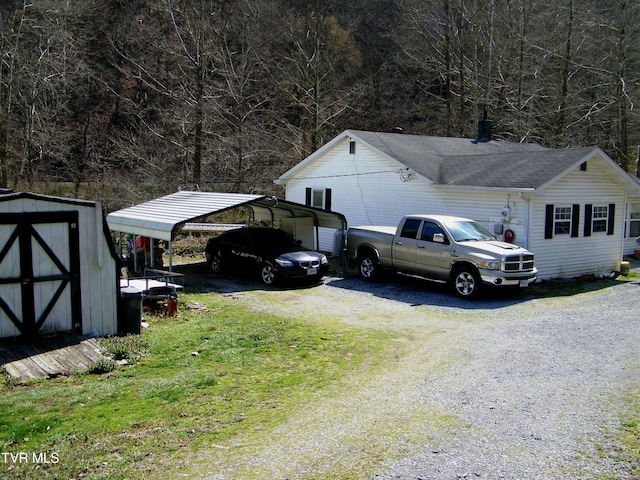 exterior space with a carport and a shed