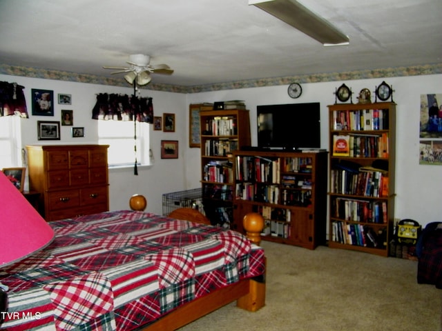 bedroom featuring ceiling fan and light carpet