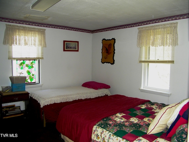 bedroom featuring a textured ceiling