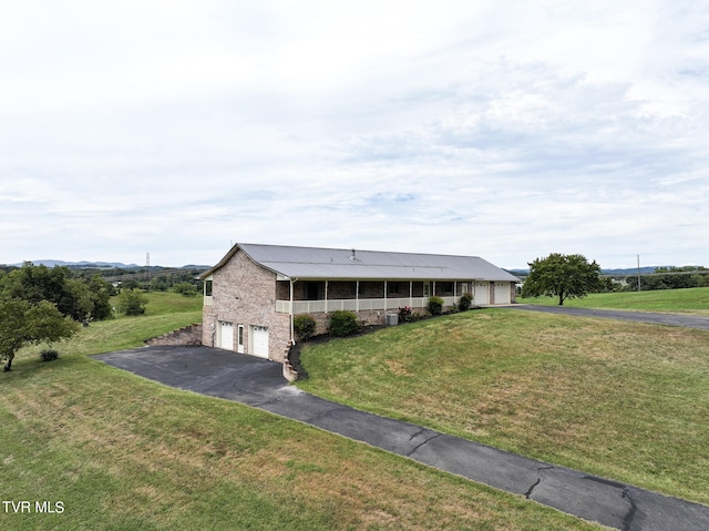 view of front of house featuring a front lawn and a porch