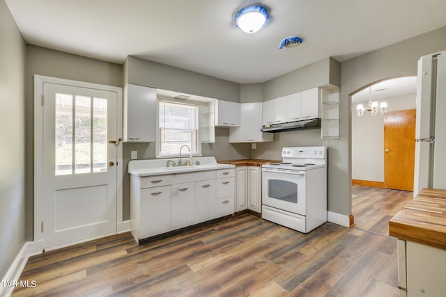 kitchen with white cabinets, white appliances, dark hardwood / wood-style flooring, and sink