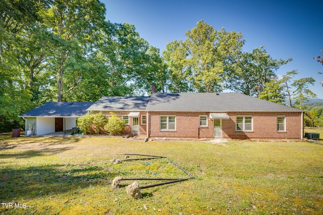 exterior space featuring a lawn and cooling unit