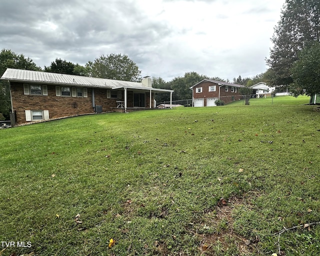 view of yard with central AC