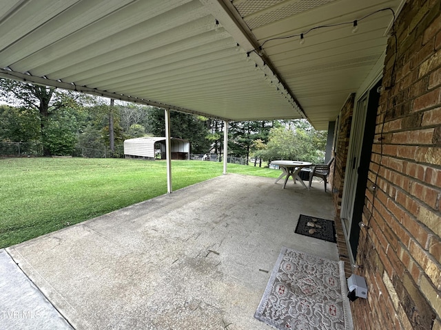 view of patio featuring a shed