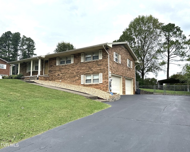 view of front of house featuring central AC, a front lawn, and a garage